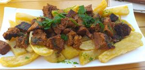 Zorza con patatas at Entre Pedras in Santiago De Compostela