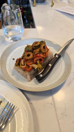 Fried peppersz capers and olives on toast at Upstairs at Anley Street  in Jersey