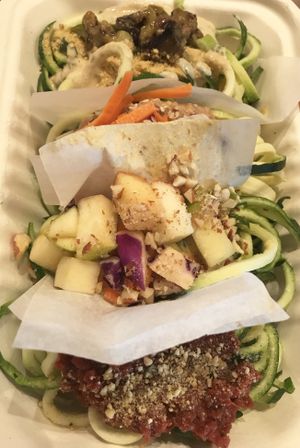 Pasta sampler in compostable to go container at Healthy Sins Vegan Cafe in Lockport