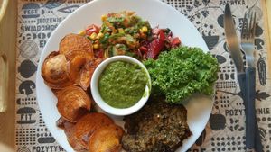 Quinoa cutlet, salad, spinach dip, sweet potato chips at Nova Krova in Krakow