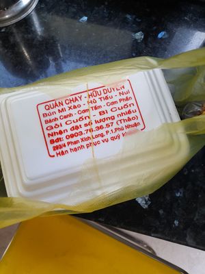 On the take away box is printed a menu, a phone number and the address! at Hữu Duyên in Ho Chi Minh City