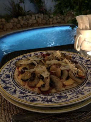 Greek Pizza with homemade cashew cheese sauce at Lo Que Hay Cafe in Merida