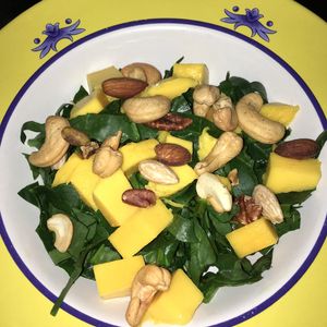 Spinach with mango, nuts & almonds at Lo Que Hay Cafe in Merida