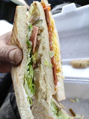Arnie sarnie and biscoff chocolate cake

Excuse the dirty worker hands! Arnie sarnie. at The Sandwich Co  in Bridgend