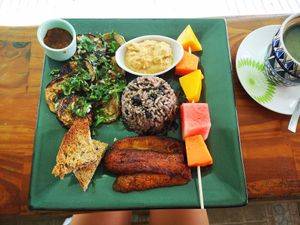 Vegan gallo pinto (hummus, roasted courgettes with garlic, plantain, bread, fruit, rice and beans) at Como En Mi Casa in Puerto Viejo De Talamanca