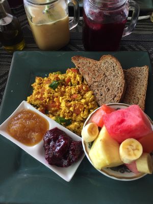 Vegan Breakfast (tofu scramble, tropical fruit, bread with jam) - drink of the day included (juice) at Como En Mi Casa in Puerto Viejo De Talamanca