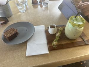 Pistachio latte with date and walnut load    at The Spotted Owl Cafe in Sunbury