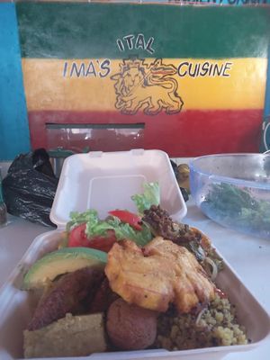 Baked oyster mushrooms served with tri-color quinoa, lentil stew, fried green plantain; croquettes, falafels and salad at Empress Ima's Ital Café & Nyce Creamery in Philipsburg