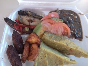 Jerk portobellos; Black bean stew; Fungi; eggplant pakora and plantains at Empress Ima's Ital Café & Nyce Creamery in Philipsburg
