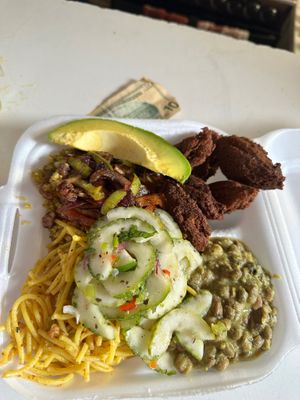 Wat a Plate! Falafel, pigeon peas coco sauce quinoa, sautéed local mushrooms 🍄‍🟫 coco aminos peppers & onions, rasta pasta tomato oregano sauce & local cucumber salad vina at Empress Ima's Ital Café & Nyce Creamery in Philipsburg