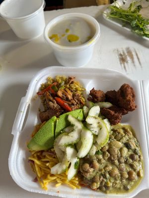 Ital Soup: coconut curry w fresh callaloo and spelt dumplings, garnished with fresh clilantro and a Plate!  at Empress Ima's Ital Café & Nyce Creamery in Philipsburg