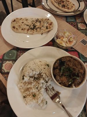 Naan and "Aloo Baingan" that was more like mushy eggplant dish, don't recommend. at Santa Masala in Santa Marta