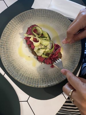 HUMMUS TOST CON ZUCCHINE MARINATE   at Ria Caffetteria Pasticceria in Solaro