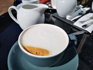 Decaf Oat Flat White at Artizan in Woodbridge