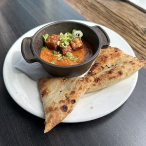 Coconut Curry (chickpea, cashew, fried tempeh, house naan)  at Bardō - Guelph in Guelph
