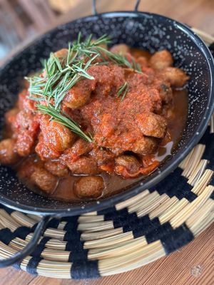 Plant-based polpette slow cooked in farmers' tomato sauce and fresh rosemary  at Mondo Mediterraneo in Amsterdam