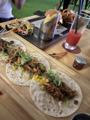 Jackfruit tacos! It comes with 3 different types of sauces.   at Seven Sports Bar - NH Collection  in Dubai