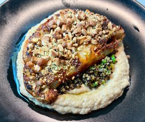 Cauliflower steak  at Seven Sports Bar - NH Collection  in Dubai