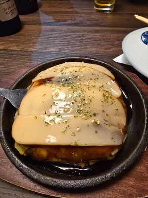 Okonimyaki with ch**se at Izakaya Gonta Hiroshima in Hiroshima