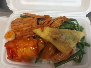 Various mock meats over rice at Thiện Ân in Ho Chi Minh City