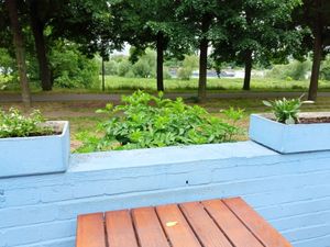 one of the tables with a view of the river Rhine at Schwimmbad Rhein-Sommergarten in Cologne