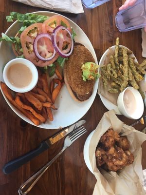 Santa Fe Crispy Chicken + Green Bean stack and fried cauliflower at Veggie Grill by Next Level in Carlsbad