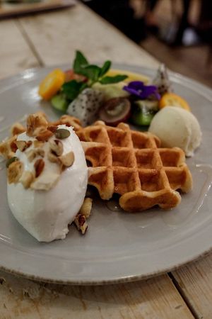 Waffle with whipped cream, ice cream and fruits at AIN SOPH.Soar in Tokyo
