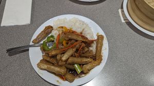Ginger beef on rice at Happy Veggie House in Calgary