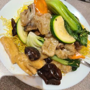 Veggie noodles crispy..not bad. Not much flavor. Good sauce  I added chili oil n soya sauce. Lots of veggies n tofu generous portion. at Happy Veggie House in Calgary