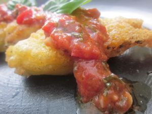 Tempura Beer Battered Squash Blossoms in Garden Herbed Tomato Sauce
This is a seasonal dish when the tomatoes are ripe and squash blossoms abound in the garden. Squash Blossoms are filled with a pine nut ricotta basil filling (dairy free).  at Revolution in the Kitchen in Denver