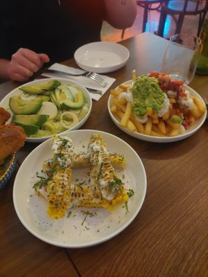 Salad, corn ribs and loaded fries at La Bohemia in Fitzroy