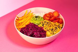 Rainbow Rice Bowl: Basmati Rice, plant-based Salmon, Purple Cabbage, julienned Carrots, Guacamole, Cherry Tomatoes, Balsamic Vinegar Glaze, white Sesame Seeds at Green M'ama  in Rome