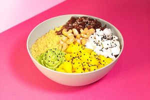 Funny Kus Kus Bowl: Cous Cous with mixed spices, plant-based Feta, Green Hummus, Mango, Cashews, Sweet and Sour Onion, Pink Mayo, black Sesame seeds at Green M'ama  in Rome