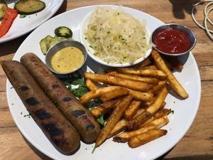 Vegan Hamburg Sausage Plate (w/ German fries & Sauerkraut) at Kiez Küche & Beer Garden  in Los Angeles