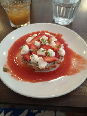 Strawberry tart with whipped cream at Mauvaise Herbe in Marseille