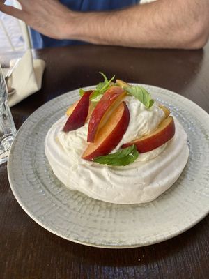 Pavlova with peaches at Mauvaise Herbe in Marseille