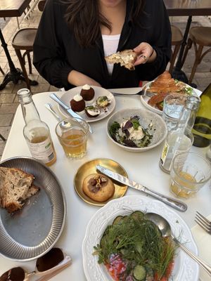 Potato croquettes, tofu and veggie croissant, vegan mozzarella with pesto, cucumber salad, and a hazelnut cookiee  at Mauvaise Herbe in Marseille