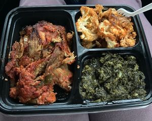 Takeout of eggplant parm entree with roasted cauliflower and spinach as sides. *chefs kiss* at ELife in Washington