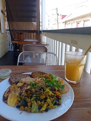 Vegan breakfast and passion fruit juice at Fresh and Natural Cafe in Roseau