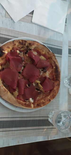 Pizza capricciosa at Swami's Garden in Praia Da Luz