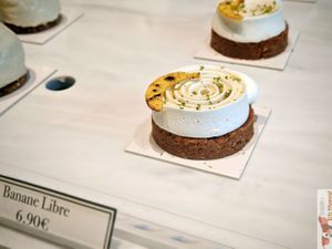 



Crunchy Breton shortbread base with chocolate, salted caramel, banana flambéed with rum, Madame coconut cream at Les Artizans - Coffee And Flower in Paris