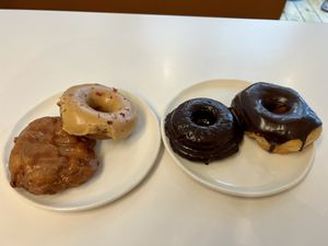 Earl grey!! Apple fritter, chocolate glazed and double chocolate cake donut  at Cartems Donuts - Downtown in Vancouver