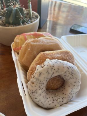 Front to back: lemon poppyseed, jelly filled, vanilla bean, citrus glaze  at Cartems Donuts - Downtown in Vancouver