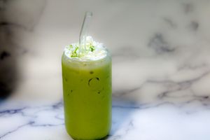 Iced Japanese Ceremonial Grade Matcha Latte topped with Coconut Whip cream! at Vegan Delights - Cloud Kitchen in Fort Lauderdale