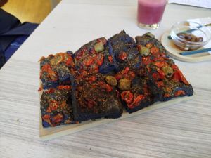 Focaccia al carbone con pomodorini e olive at Red Carrot in Turin