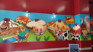Happy mural inside at Babes Ice Cream in Milwaukee