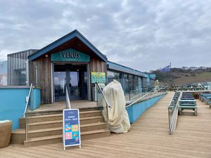 Exterior (more outdoor seating on the deck upstairs)   at The Venus Cafe - Broadsands in Paignton