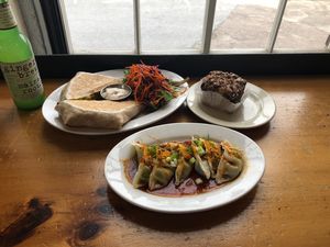 Crunchwrap, dumplings and a coffee cake. Starving much? at Pingala Cafe in Burlington