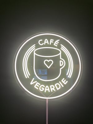 The sign is on the wall  at Café Vegardie in Berlin