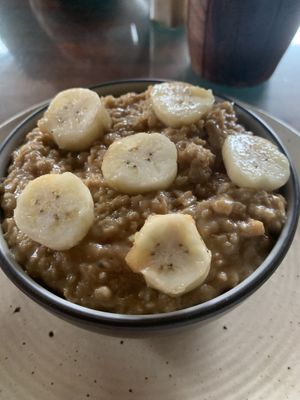 Oatmeal porridge with added banana and date syrup instead of honey    at The Dreaming Tree in Tiruvannamalai